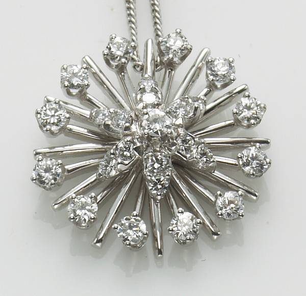 Appraisal: A diamond k white gold pendant and chain with cultured