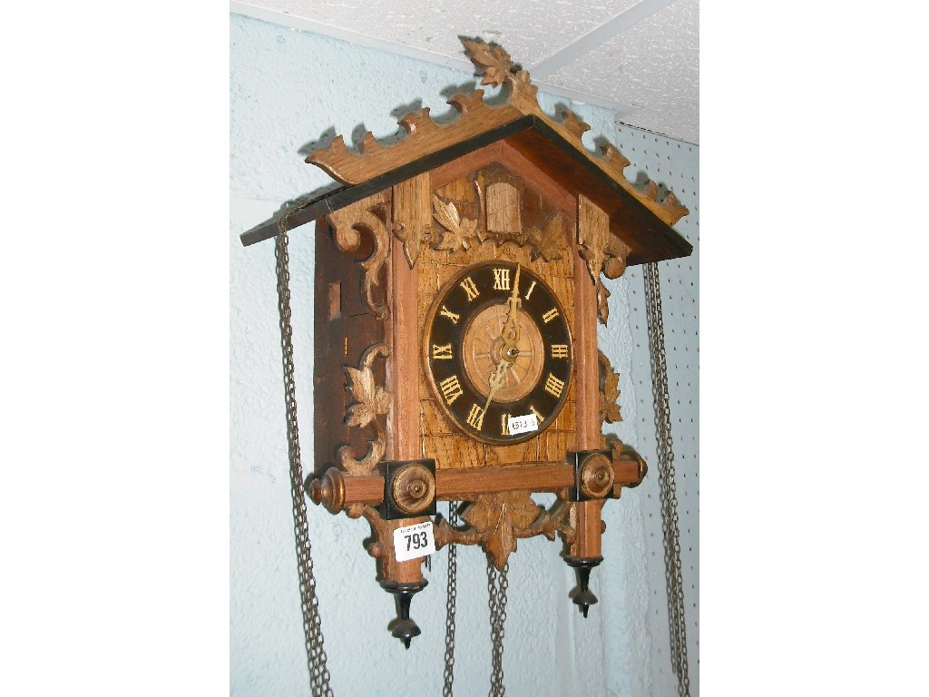 Appraisal: Black Forest cuckoo wall clock the dial within a chalet