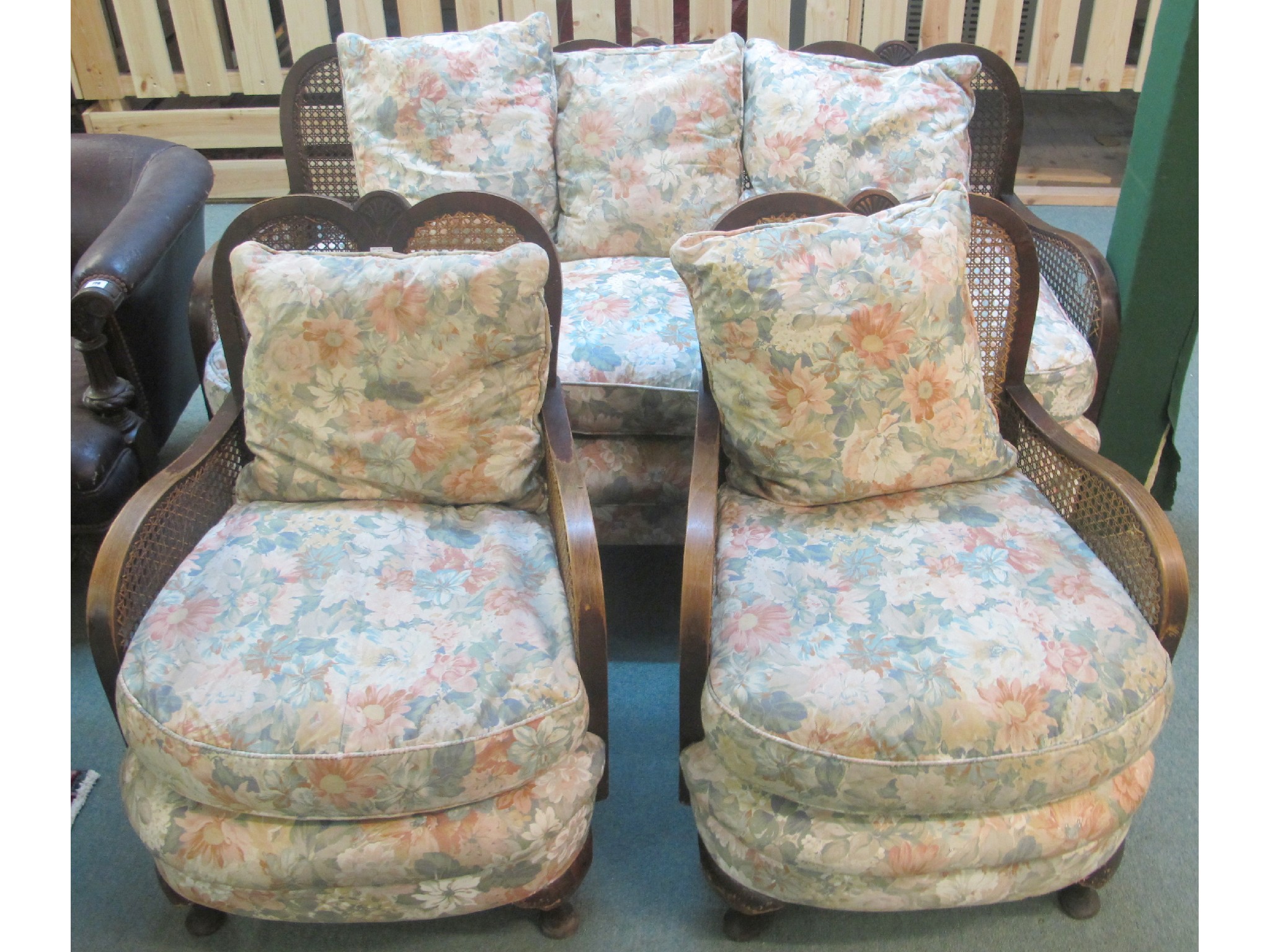 Appraisal: A Bergere mahogany sweetheart settee and two armchairs