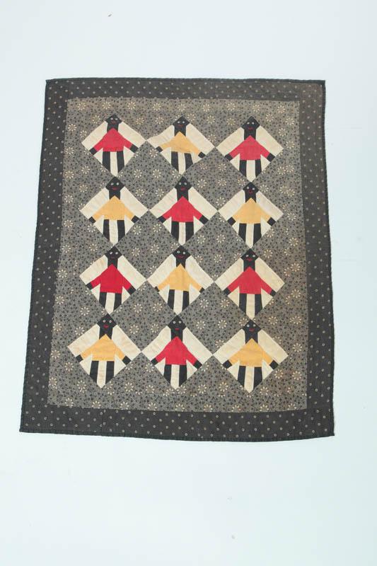 Appraisal: CHILD'S QUILT Pieced quilt with twelve diamonds depicting black children