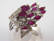 Appraisal: A white metal tests carat gold ruby and diamond ring