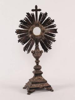 Appraisal: SILVER EMBOSSED MONSTRANCE WITH CUPID IN RELIEF ON PAW FEET