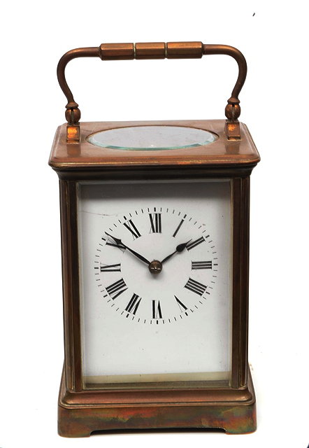 Appraisal: A FRENCH BRASS CASED CARRIAGE CLOCK with white enamel Roman