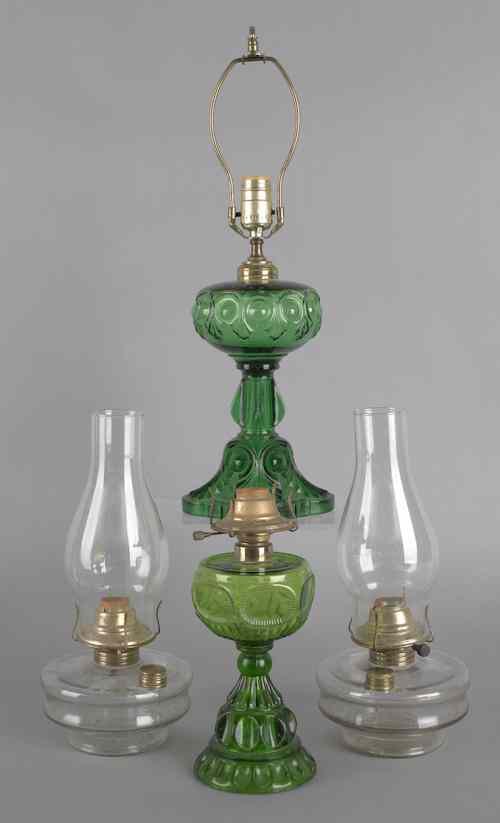 Appraisal: Four electrified kerosene lamps two with iron wall brackets