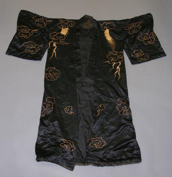 Appraisal: Asian black silk robe embroidered with metallic designs the back