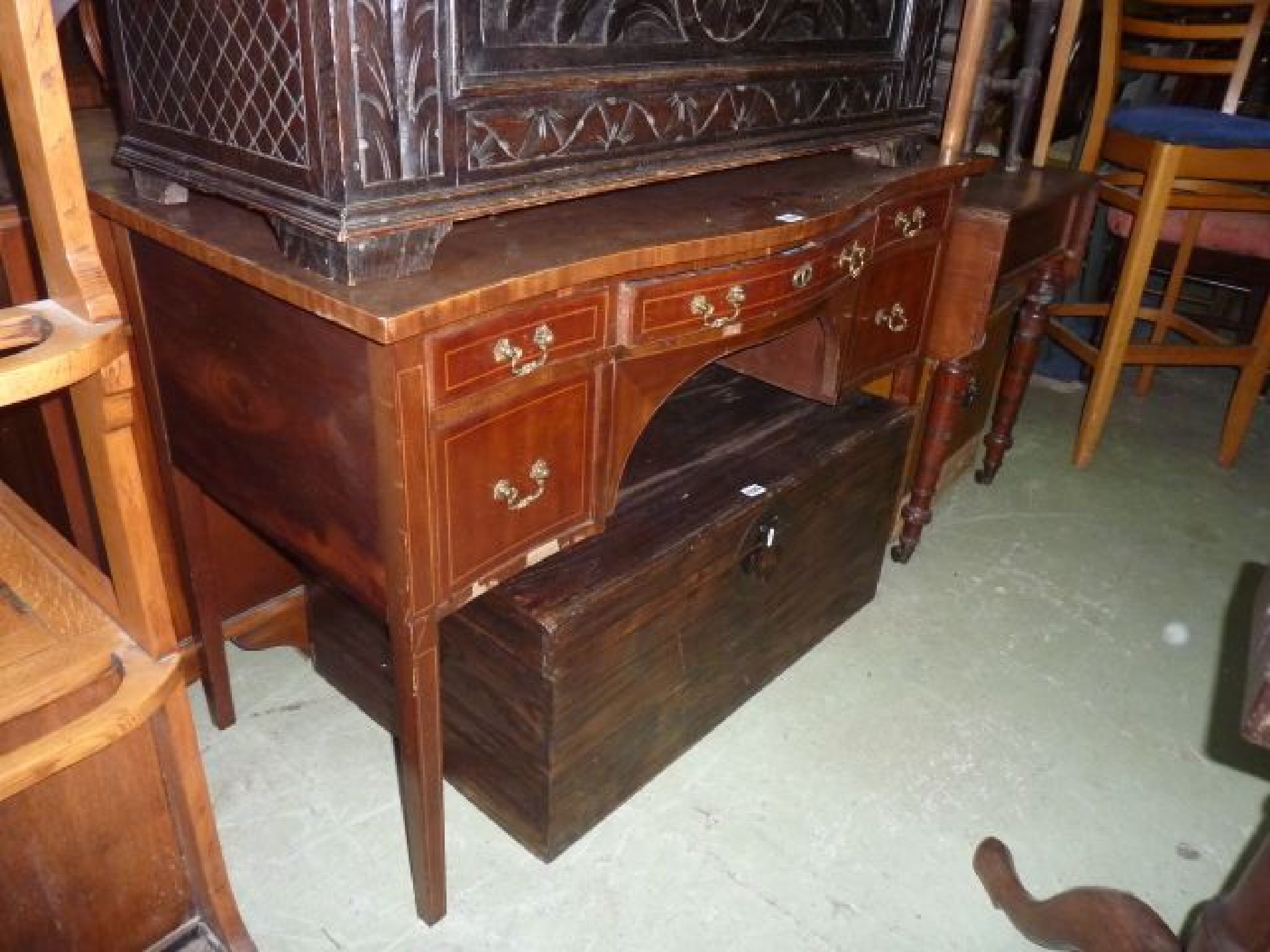 Appraisal: A small Georgian mahogany serpentine sideboard enclosed by an arrangement