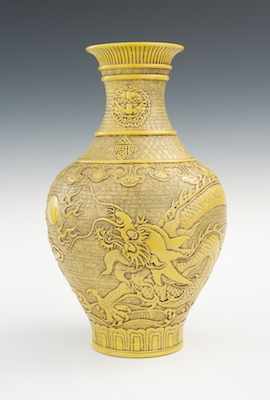 Appraisal: A Large Chinese Molded Earthenware Relief Vase The baluster form