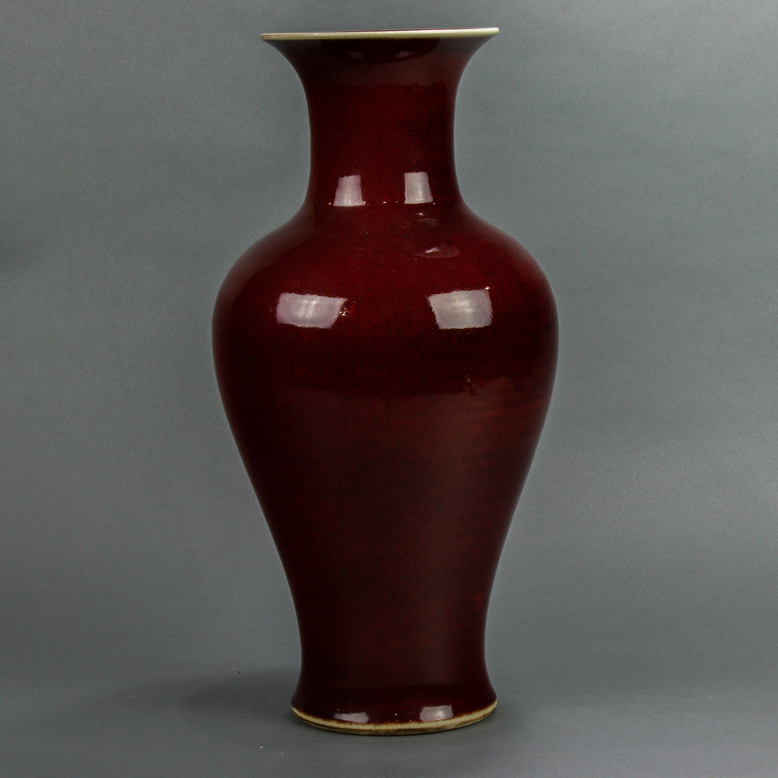 Appraisal: Chinese oxblood glazed vase the body of tall baluster form