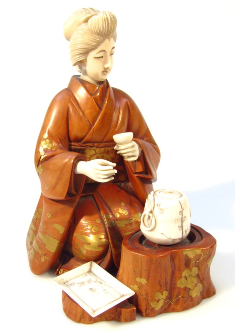 Appraisal: A Japanese Meiji period carved ivory and boxwood figure of