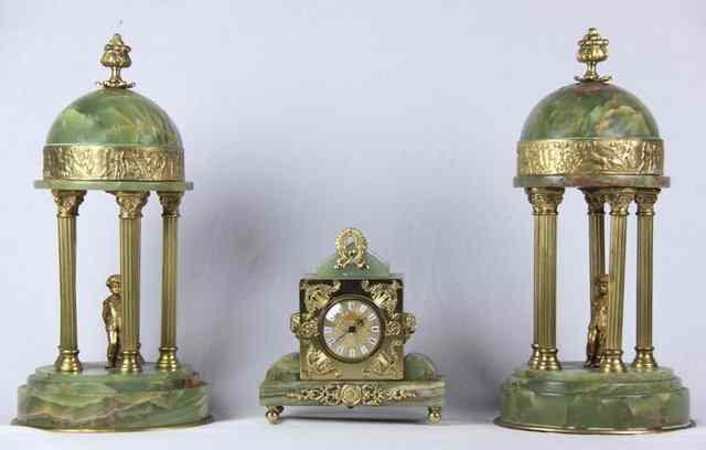 Appraisal: A small green alabaster mantel clock and a pair of