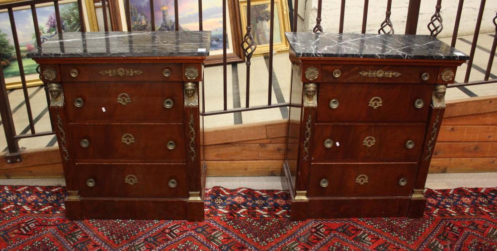 Appraisal: A PAIR OF MARBLE-TOPPED AND ORMOLU-MOUNTED FOUR-DRAWER COMMODES French Empire