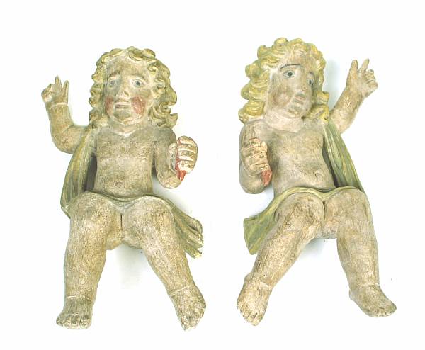 Appraisal: A pair of polychrome decorated Baroque style cherubs height in