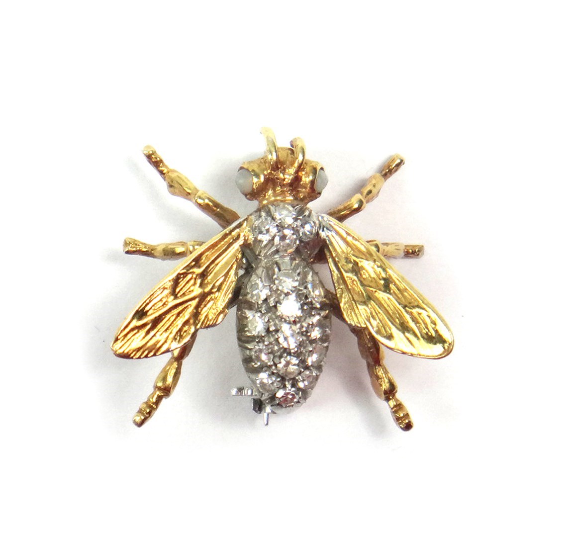 Appraisal: A gold and diamond set brooch designed as a winged