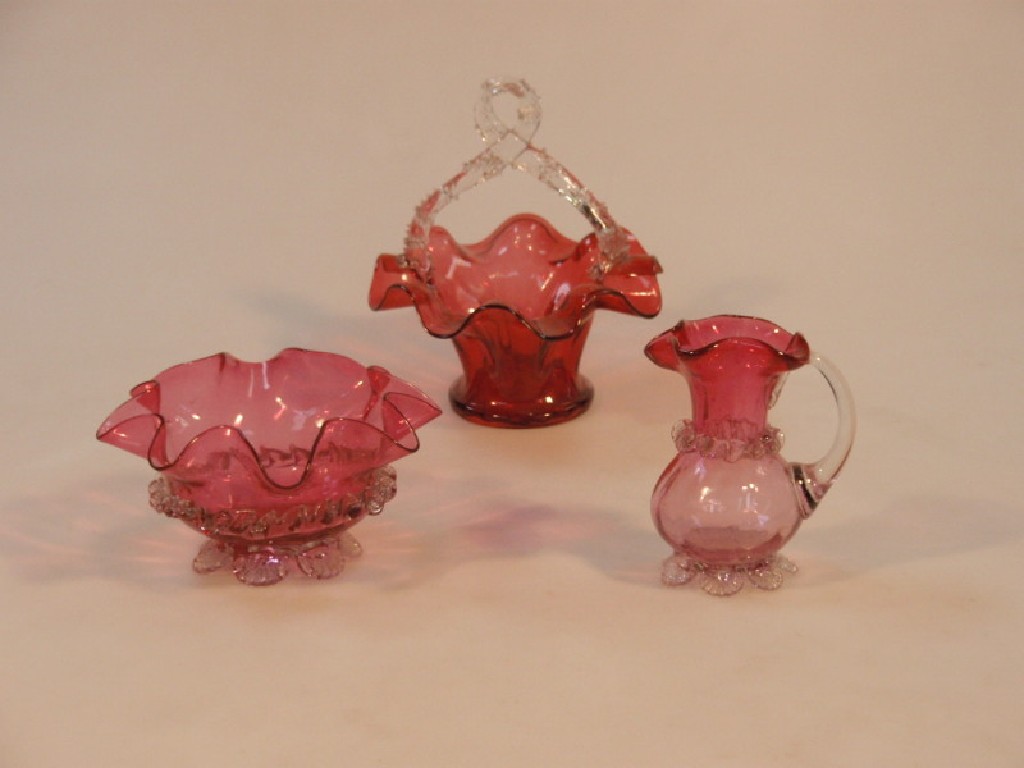 Appraisal: A cranberry glass frill edge basket with clear sprigged overhead