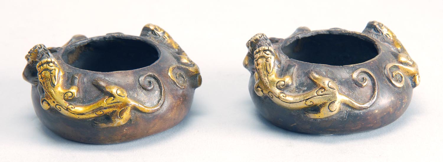 Appraisal: PAIR OF GILT-BRONZE WRITER'S COUPES With qilong dragons at shoulders