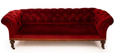 Appraisal: A Victorian Chesterfield sofa on turned fluted front legs with