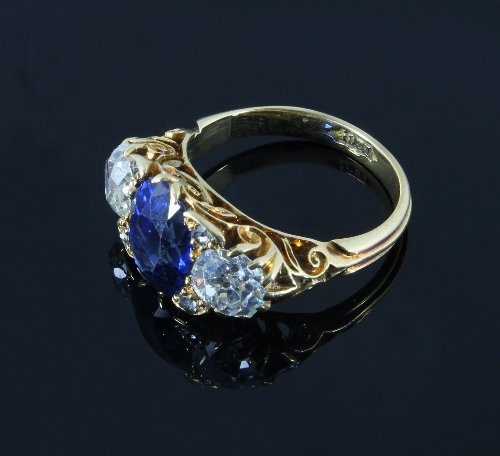 Appraisal: A sapphire and diamond three-stone ring the central oval Ceylon