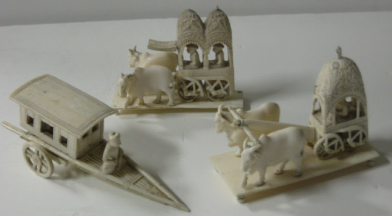 Appraisal: THREE INDIAN IVORY MINIATURE GROUPS A cart with figures and