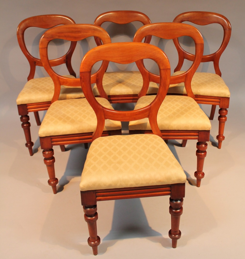 Appraisal: A set of six mahogany balloon back dining chairs each