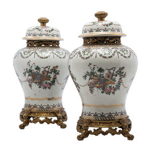 Appraisal: A Pair of United Wilson Gilt Metal Mounted Porcelain Urns