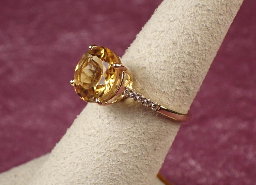 Appraisal: CITRINE DIAMOND AND FOURTEEN KARAT GOLD RING The yellow gold