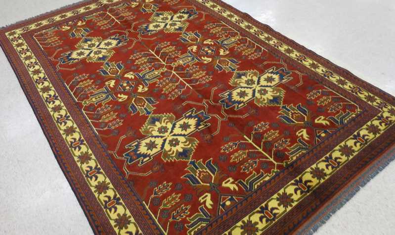 Appraisal: HAND KNOTTED ORIENTAL CARPET Pakistani-Persian four medallion and stylized floral