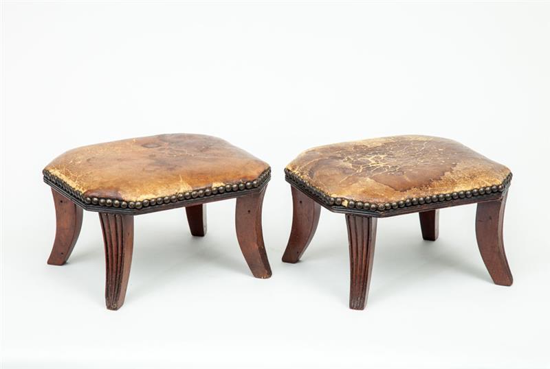 Appraisal: Pair of Victorian Carved Mahogany Foot Stools With nailed leather