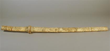 Appraisal: Japanese carved bone short sword Of slight convex form pieced