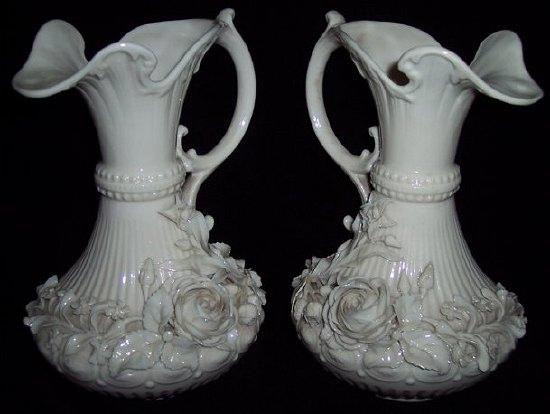 Appraisal: A pair of Belleek Aberdeen jugs of fluted form with