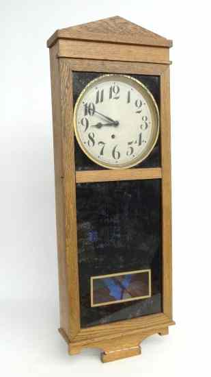 Appraisal: Oak case Ingraham wall clock with pendelum and key ''