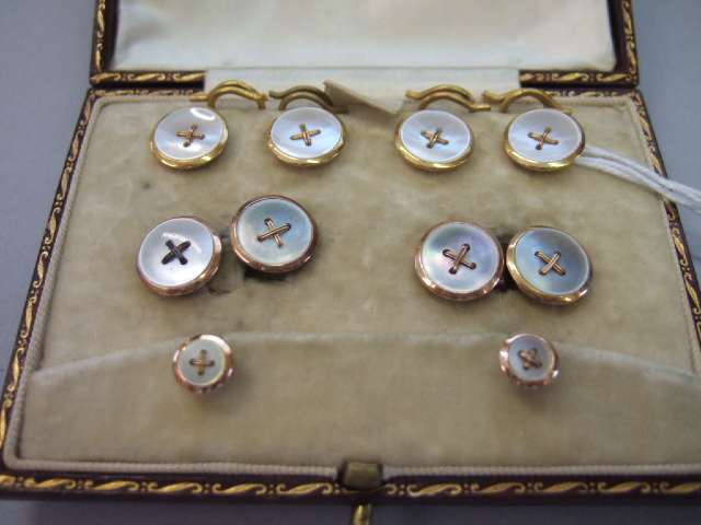 Appraisal: A gentleman's gold and mother of pearl dress set comprising