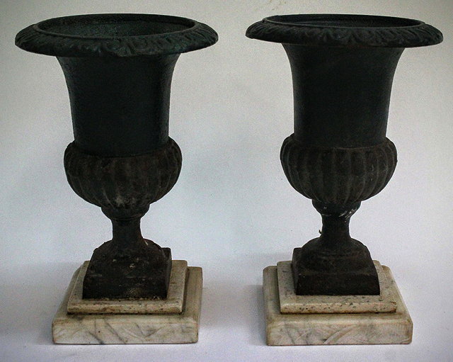 Appraisal: A PAIR OF VICTORIAN SMALL SIZED CAMPANA CAST IRON URNS