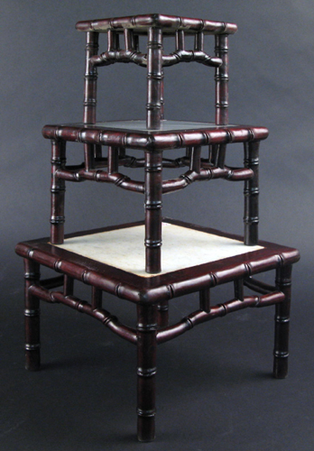 Appraisal: A SET OF THREE CHINESE ROSEWOOD NESTING DISPLAY TABLES bamboo-form