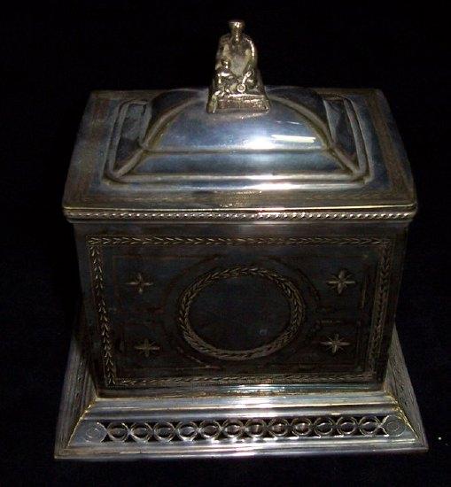 Appraisal: A plated tea caddy the hinged cover with seated figure