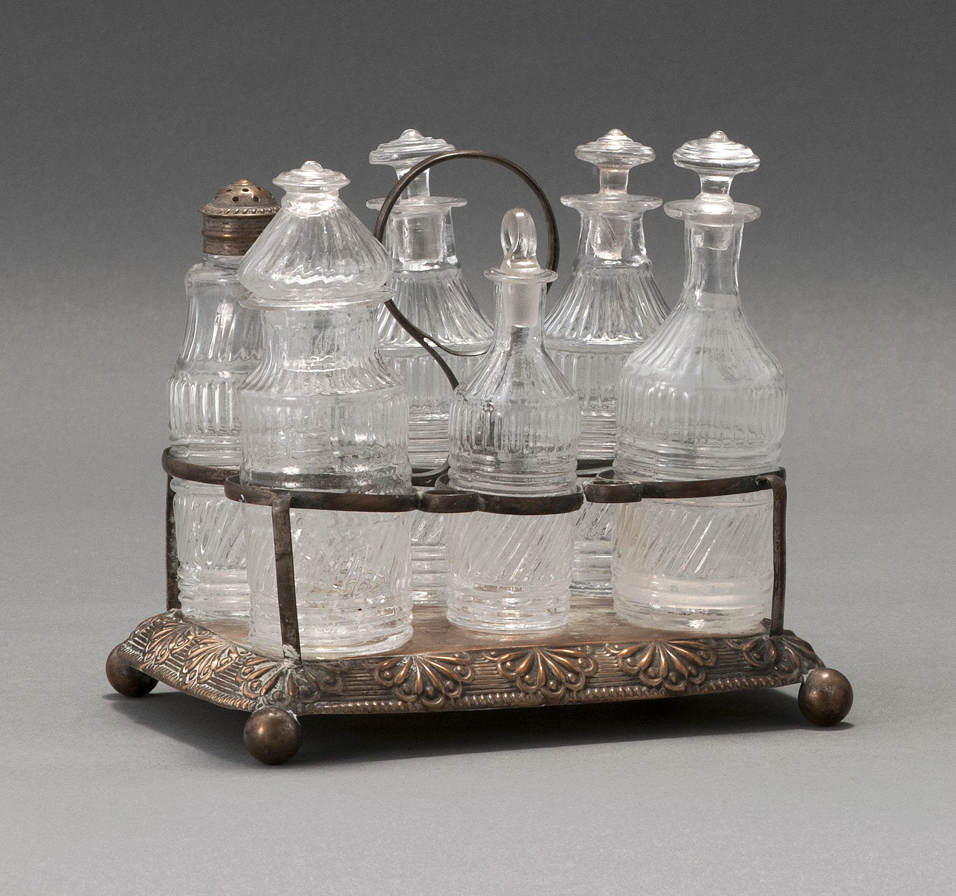 Appraisal: SIX-BOTTLE CLEAR GLASS BLOWN -MOLD CASTOR SET Second Quarter of