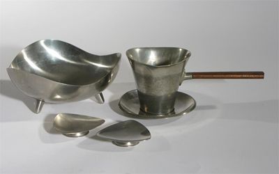 Appraisal: A Viners pewter and rosewood pourer and saucer designed by