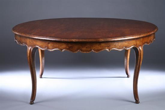 Appraisal: FRENCH PROVINCIAL STYLE WALNUT CIRCULAR DINING TABLE th century with