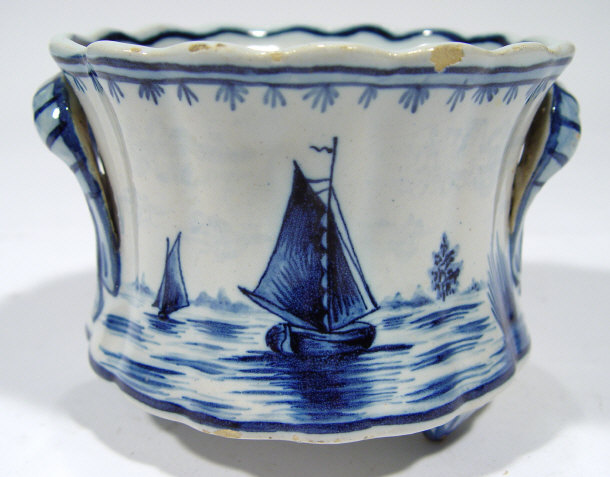 Appraisal: Fluted Delft pottery two handled bowl painted with blue flowers