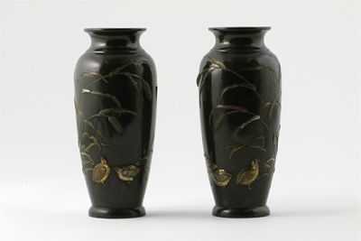 Appraisal: A pair of small Japanese bronze vases decorated in relief