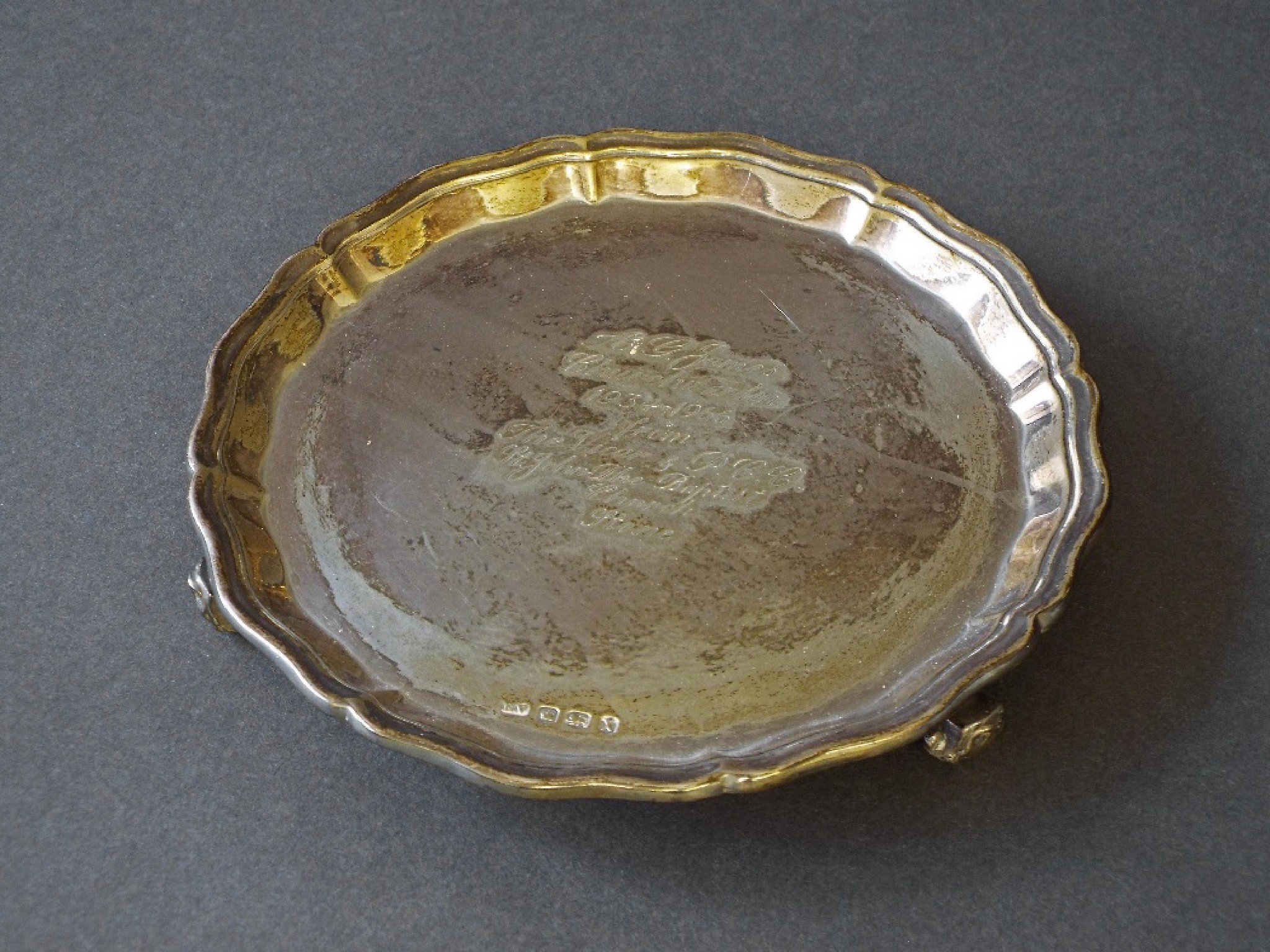 Appraisal: s silver wavy rimmed waiter with central inscription upon claw