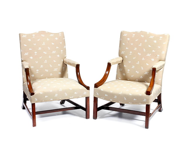 Appraisal: A NEAR PAIR OF GEORGE III MAHOGANY GAINSBOROUGH ARMCHAIRS with