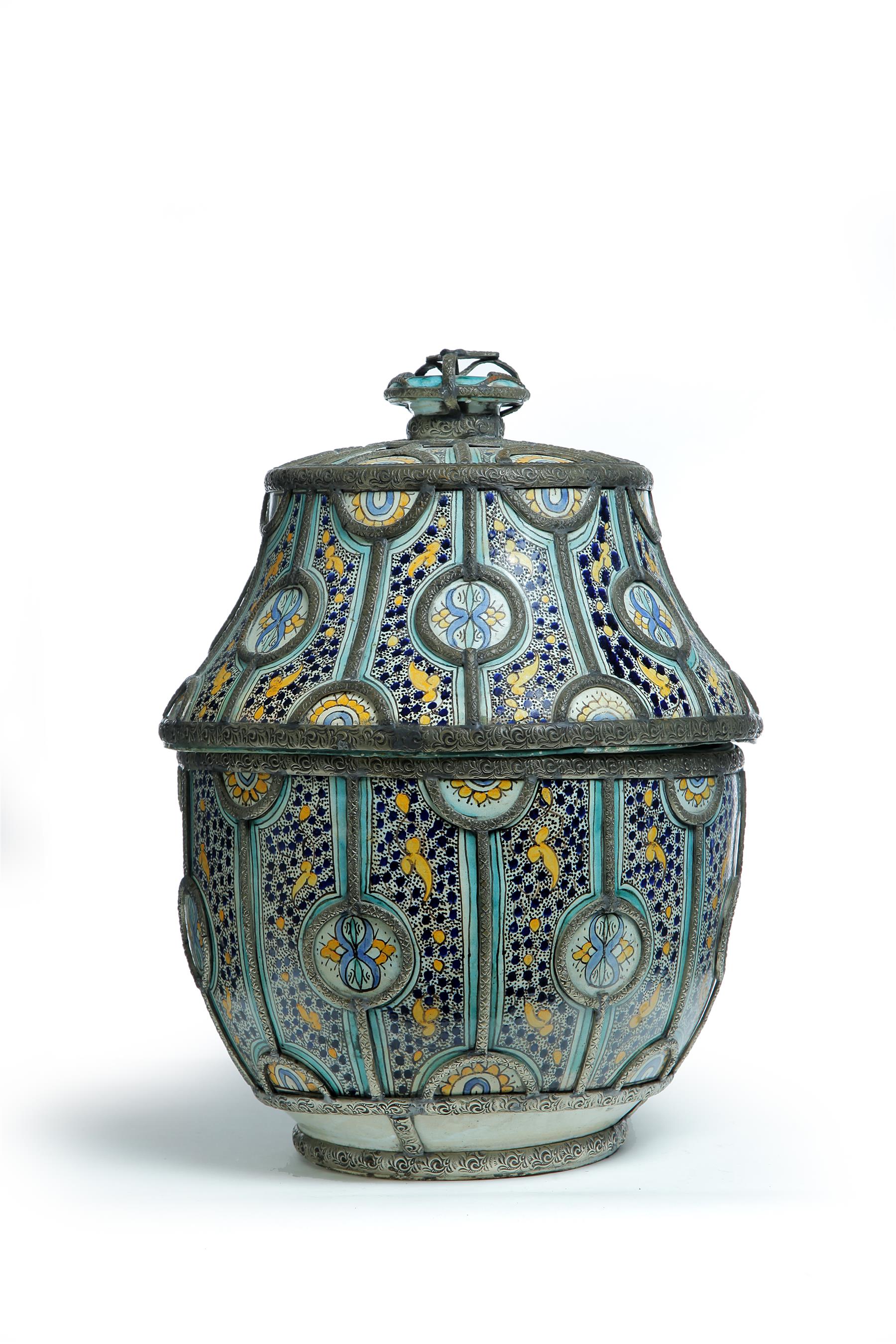 Appraisal: MOROCCAN FAIENCE COVERED CONTAINER Twentieth century Polychrome design with white