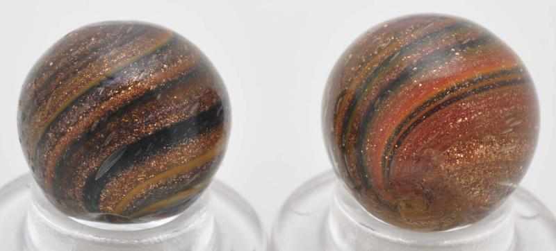 Appraisal: Lot of Onionskin Lutz Marbles Description Both have some yellow