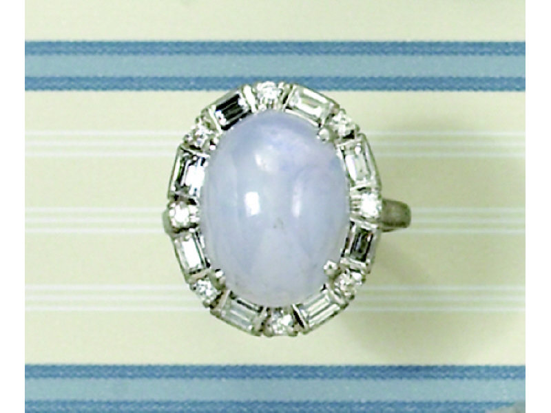 Appraisal: STAR SAPPHIRE AND DIAMOND RING Platinum ring set with one