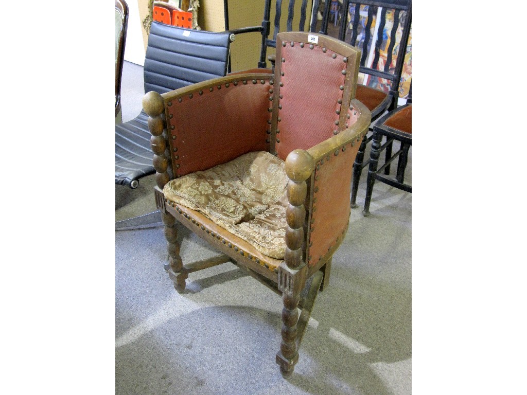 Appraisal: Mahogany leatherette upholstered tub chair on bobbin turned supports