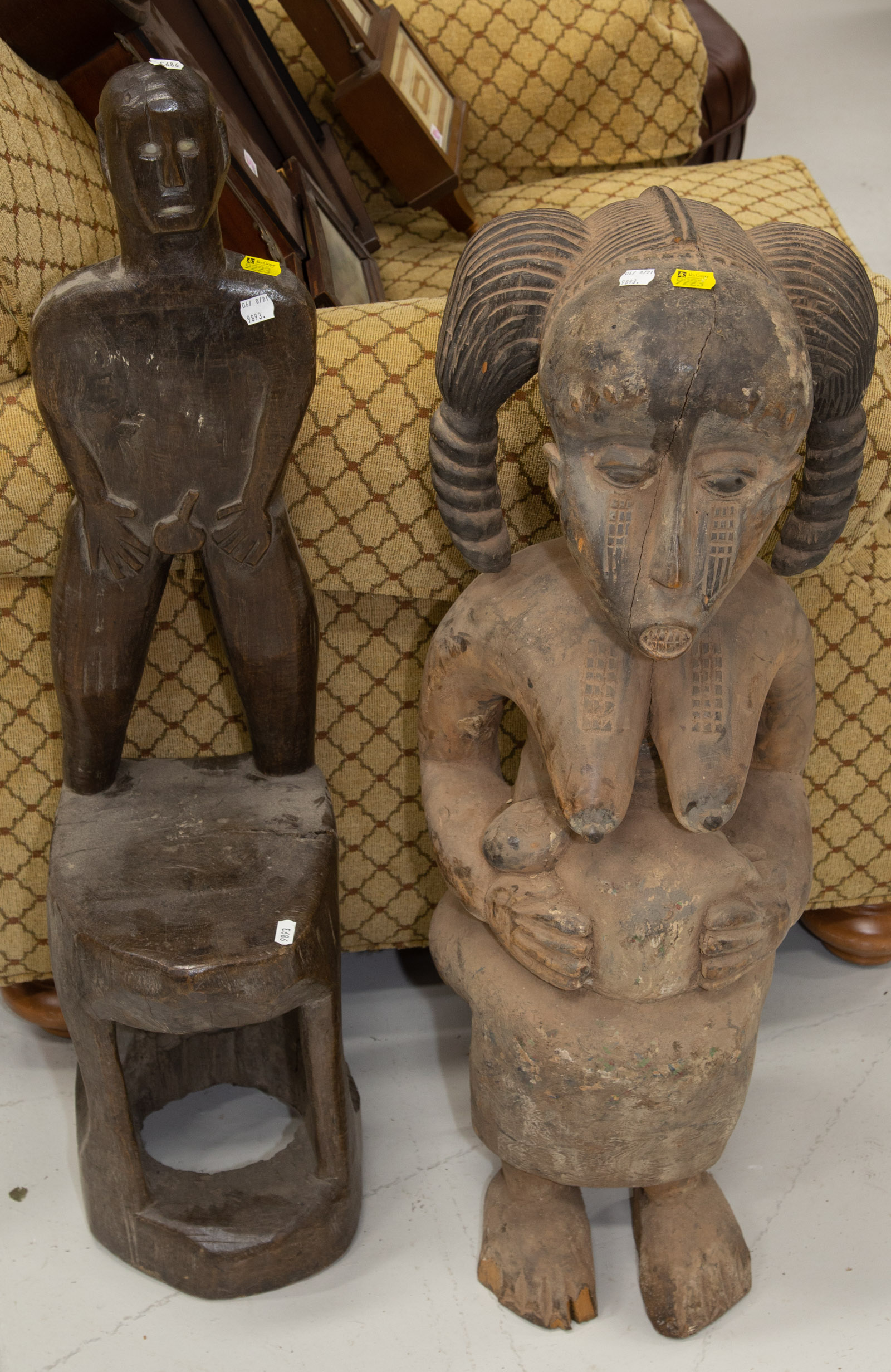 Appraisal: TWO AFRICAN SCULPTURES th century including a Senufo-influenced figure of