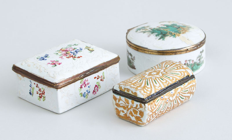 Appraisal: TWO SOUTH STAFFORDSHIRE SNUFF BOXES AND A CONTINENTAL PORCELAIN CIRCULAR