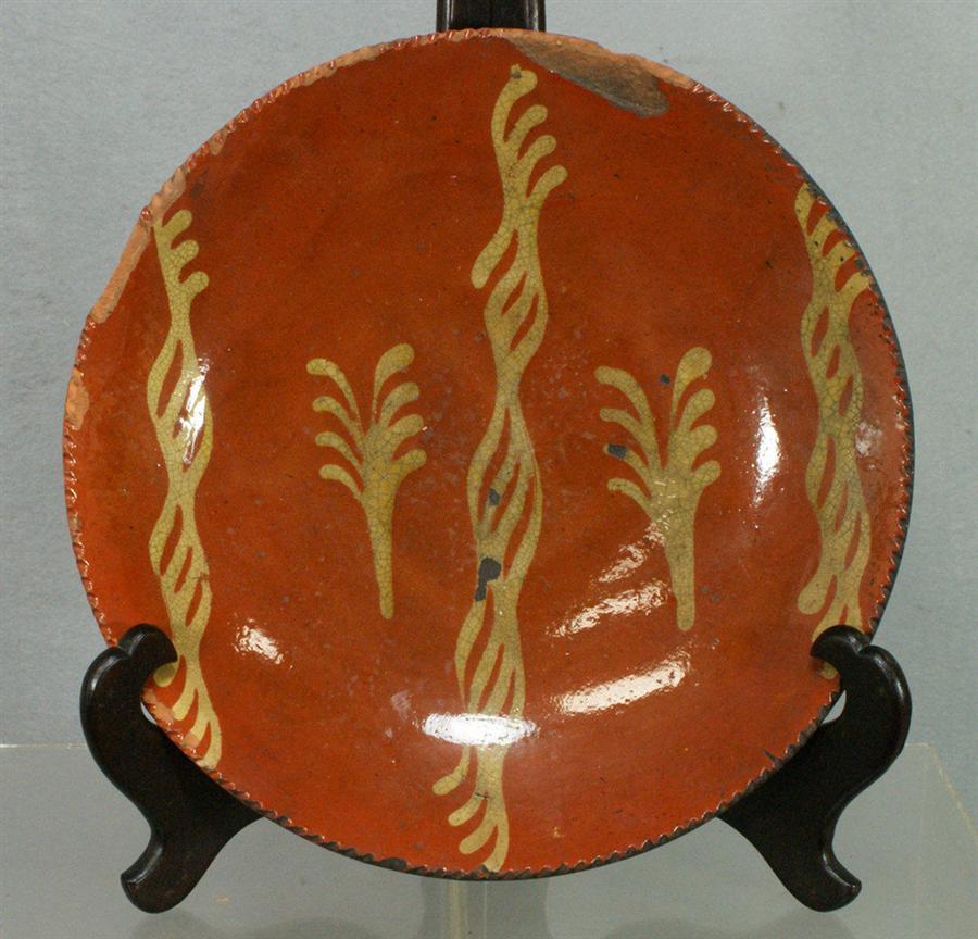 Appraisal: Slip decorated redware charger with fern decoration d several large