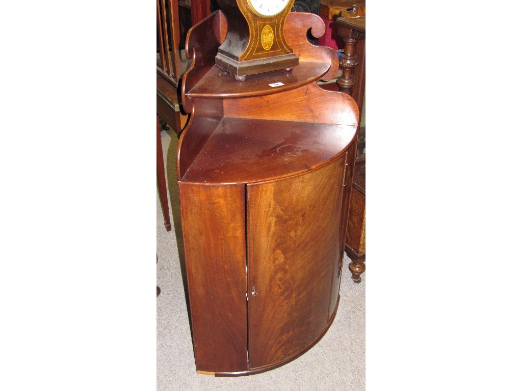 Appraisal: Mahogany bow fronted hanging corner cabinet