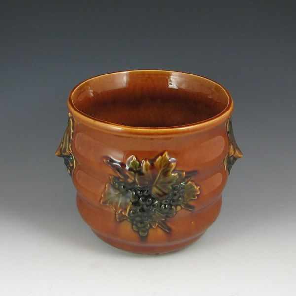 Appraisal: McCoy Planter brown and green with decorative design '' h